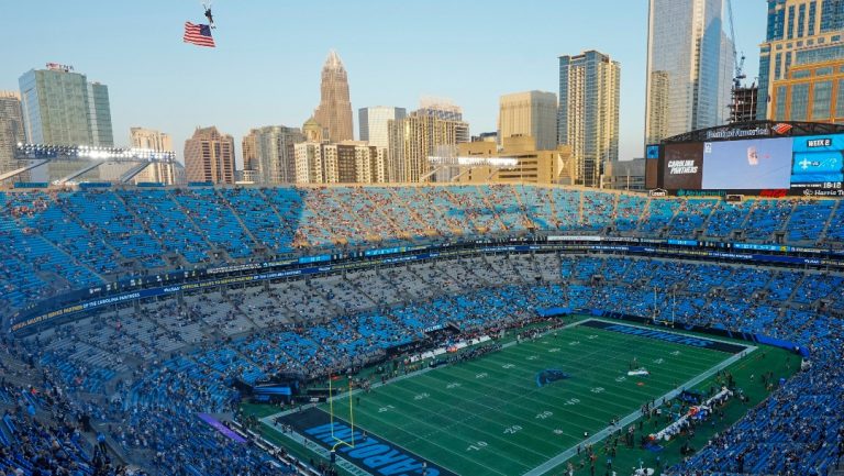 Fans stand for the national anthem before an NFL football game between the Carolina Panthers and the New Orleans Saints Monday, Sept. 18, 2023, in Charlotte, N.C. (AP Photo/Rusty Jones)