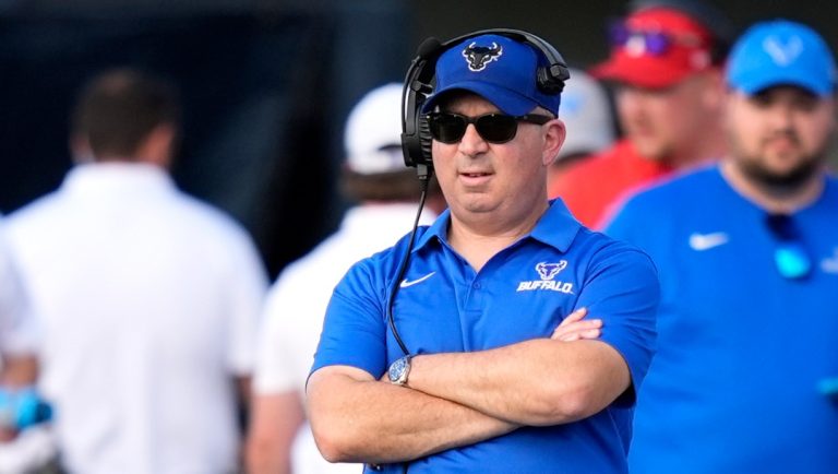 Buffalo head coach Pete Lembo, left, watches his team during the second half of an NCAA college football game against Northern Illinois on Saturday, Sept. 21, 2024, in DeKalb, Ill. (AP Photo/Charles Rex Arbogast)