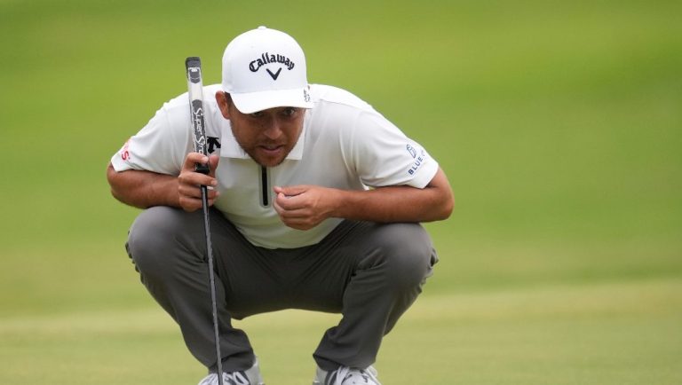 Xander Schauffele eyes a putt on the first green during the second round of the St. Jude Championship golf tournament Friday, Aug. 8, 2025, in Memphis, Tenn.