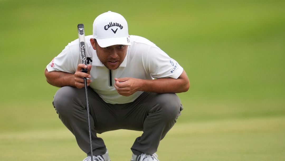Xander Schauffele eyes a putt on the first green during the second round of the St. Jude Championship golf tournament Friday, Aug. 8, 2025, in Memphis, Tenn.