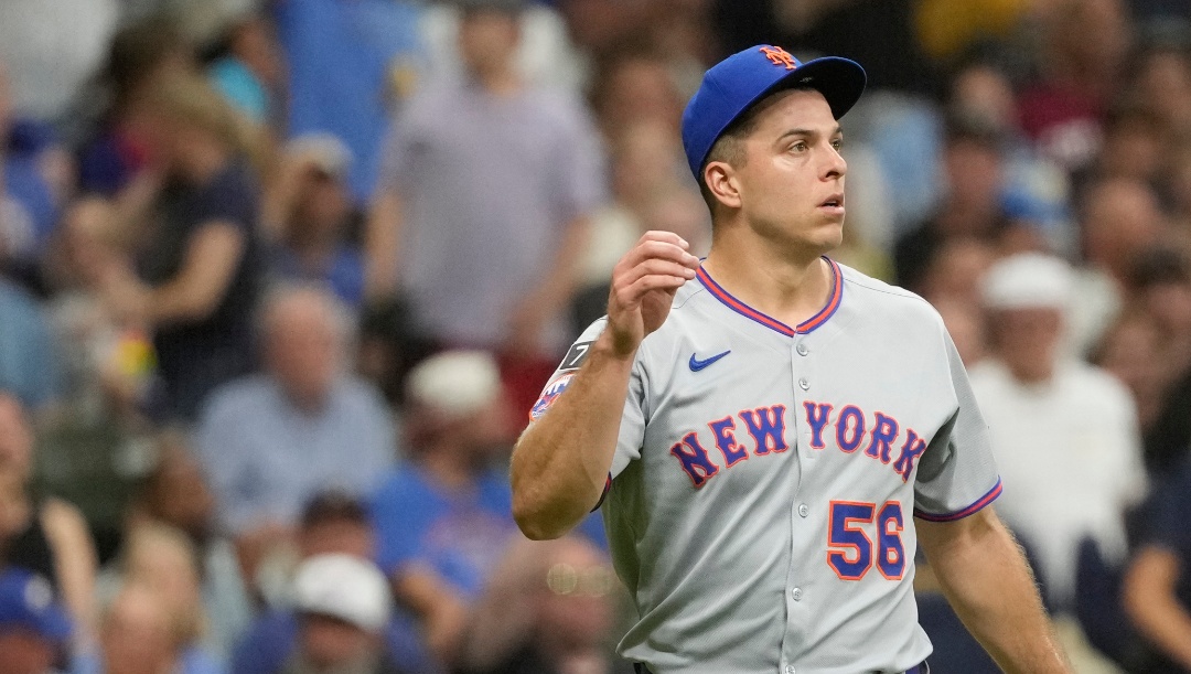 New York Mets' Ryan Helsley looks on during a baseball game against the Milwaukee Brewers, Saturday, Aug. 9, 2025, in Milwaukee. (AP Photo/Aaron Gash)