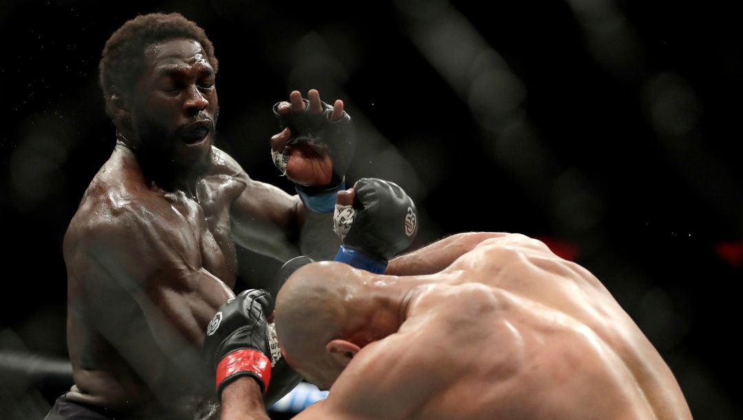 Jared Cannonier, left, throws a punch at David Branch during the second round of a middleweight mixed martial arts bout.