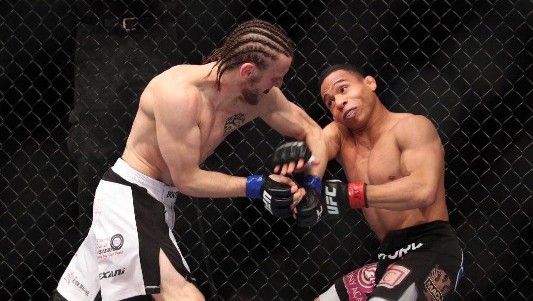 John Dodson, right, in action against Tim Elliott during their bout at UFC on Fox at the Izod Center in E. Rutherford, NJ.