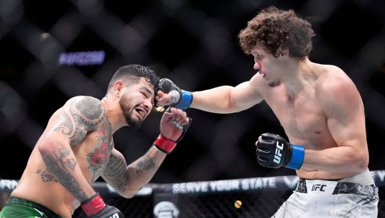 Roman Kopylov, right, connects with Anthony Hernandez during their middleweight bout at the UFC 298 mixed martial arts event.