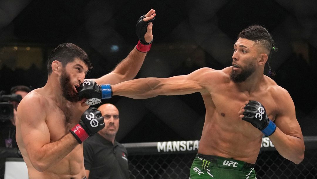 Magomed Ankalaev of Russia, left, battles Johnny Walker of Brazil in a light heavyweight fight during the UFC 294 event.