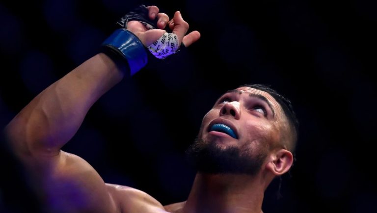 Brazil's Johnny Walker celebrates victory over United Kingdom's Paul Craig in their light heavyweight bout at the UFC 283.