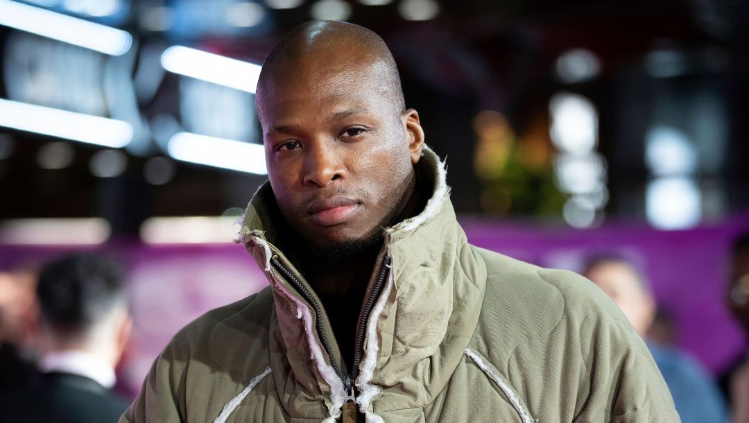 Michael Page poses for photographers upon arrival for the World premiere film 'Sumotherhood' in London, Tuesday, Oct. 10, 2023.