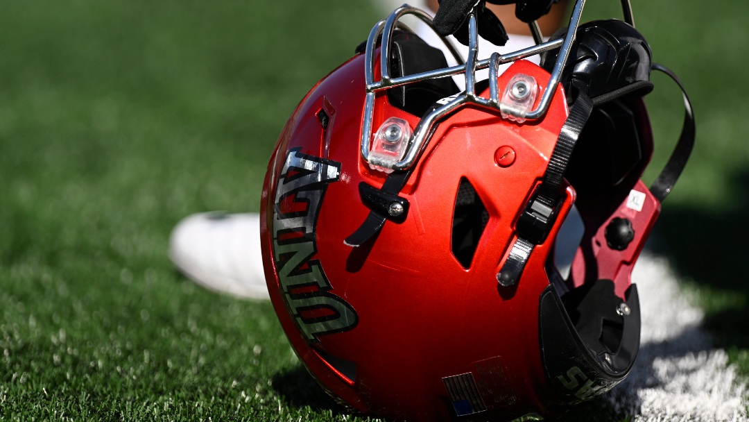 UNLV offensive lineman Leif Fautanu (79) rests his helmet on the turf before the NCAA college football game against Notre Dame, Saturday, Oct. 22, 2022, in South Bend, Ind. (AP Photo/Marc Lebryk)