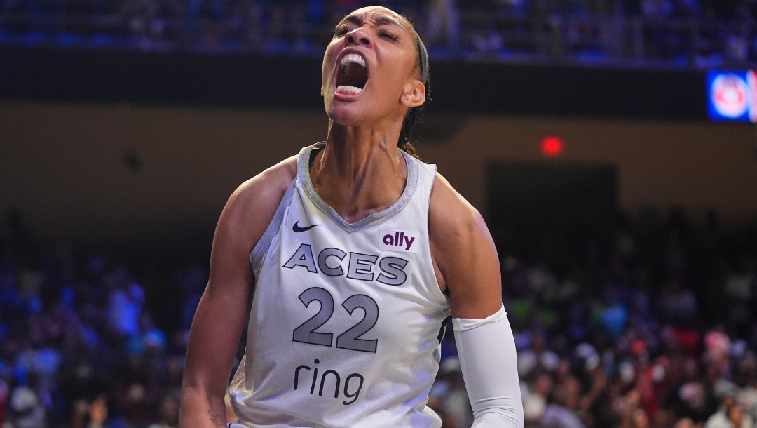 Las Vegas Aces center A'ja Wilson (22) reacts to scoring during the second half of a WNBA basketball game against the Dallas Wings in Arlington, Texas, Wednesday, July 16, 2025.