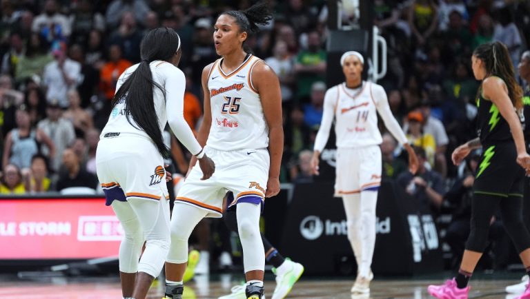 Phoenix Mercury forward Alyssa Thomas (25) greets guard Kahleah Copper, left, after making a basket against the Seattle Storm during the second half of a WNBA basketball game Sunday, Aug. 17, 2025, in Seattle.
