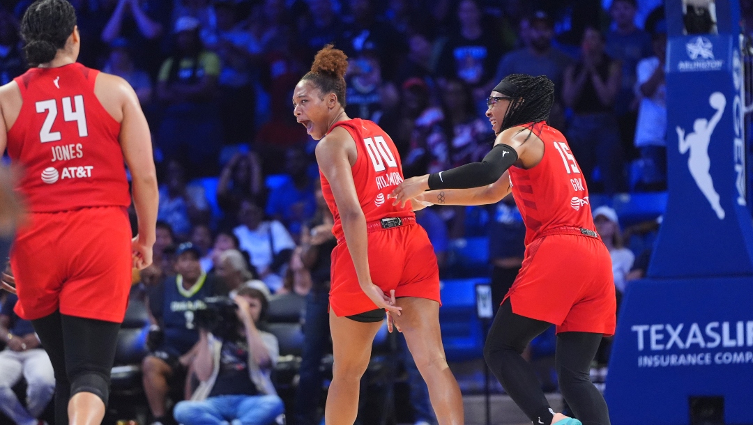 Atlanta Dream forward Naz Hillmon (00) celebrates hitting a game winning shot with teammates guard Allisha Gray (15) and forward Brionna Jones (24) during the second half of a WNBA basketball game against the Dallas Wings in Arlington, Texas, Wednesday, July 30, 2025.