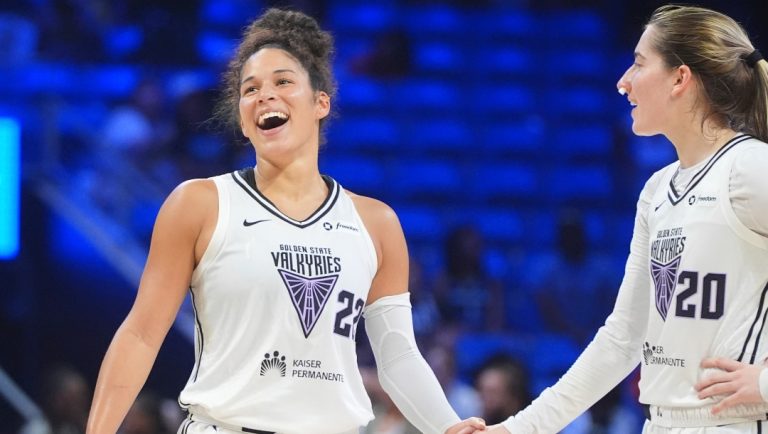 Golden State Valkyries guards Veronica Burton (22) and Kate Martin (20) smile during the second half of a WNBA basketball game against the Dallas Wings in Arlington, Texas, Sunday, Aug. 24, 2025.