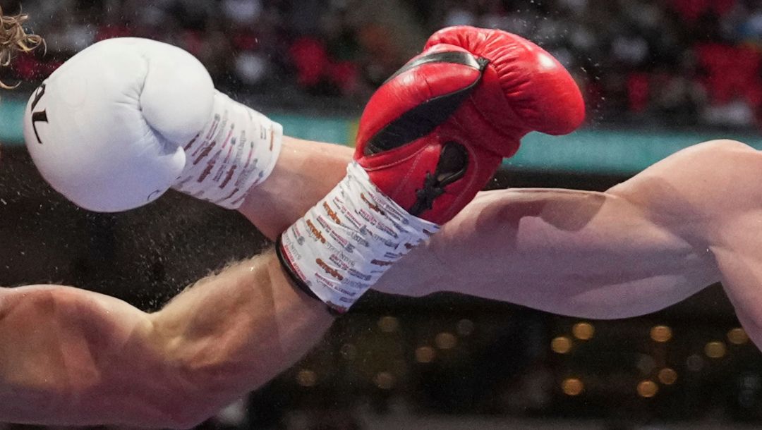 Ukraine's Daniel Lapin, right, and United Kingdom's Lewis Edmondson in action during a light-heavyweight championship fight.