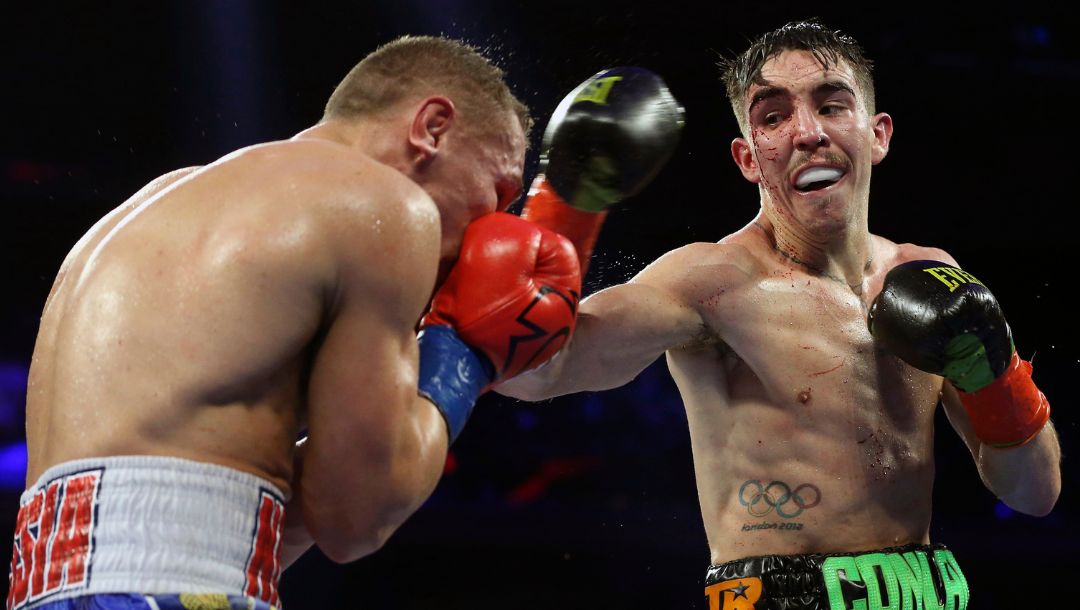 Ireland's Michael Conlan, right, punches Russia's Vladimir Nikitin during the ninth round.