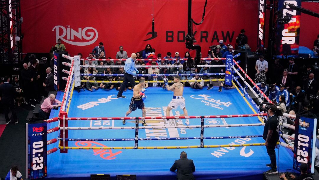 People gather in Times Square to watch a boxing match Friday, May 2, 2025, in New York.
