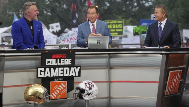 From left, Pat Mcafee, Nick Saban and Kirk Herbstreit talk on the set of ESPN College Gameday on Saturday, Aug. 31, 2024, in College Station, Texas.