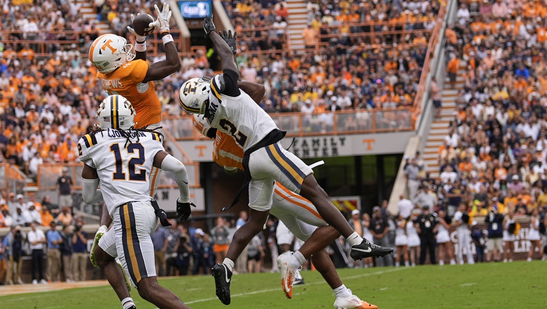 Tennessee wide receiver Mike Matthews (4) makes a catch for a touchdown over East Tennessee State defensive backs Jason Duclona (2) and Kensly Johnson (12) during the first half of an NCAA college football game Saturday, Sept. 6, 2025, in Knoxville, Tenn.