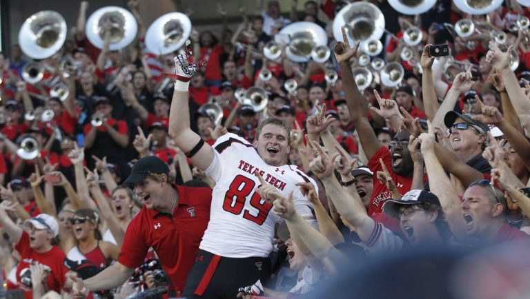 Texas Tech tight end Cameron Wright (89) celebrates with fans after an NCAA college football game against the TCU Saturday, Oct. 20, 2012, in Fort Worth. Texas Tech won 56-53 in triple overtime.