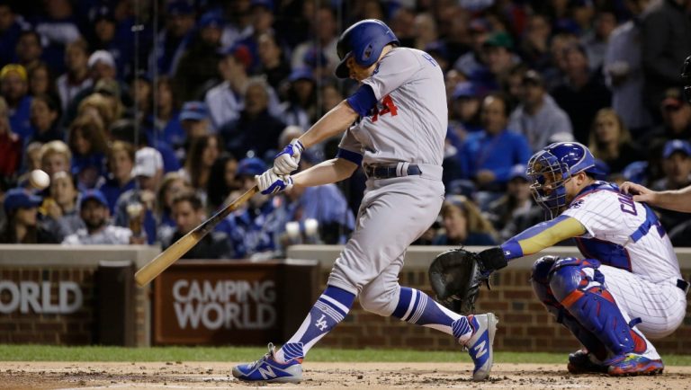 Los Angeles Dodgers' Enrique Hernandez (14) hits a home run off Chicago Cubs starting pitcher Jose Quintana during the second inning of Game 5 of baseball's National League Championship Series, Thursday, Oct. 19, 2017, in Chicago.
