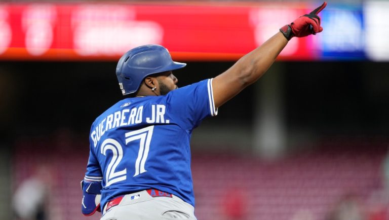 Toronto Blue Jays Vladimir Guerrero Jr. gestures after hitting a solo home run during the fifth inning of a baseball game against the Cincinnati Reds Wednesday, Sept. 3, 2025, in Cincinnati.