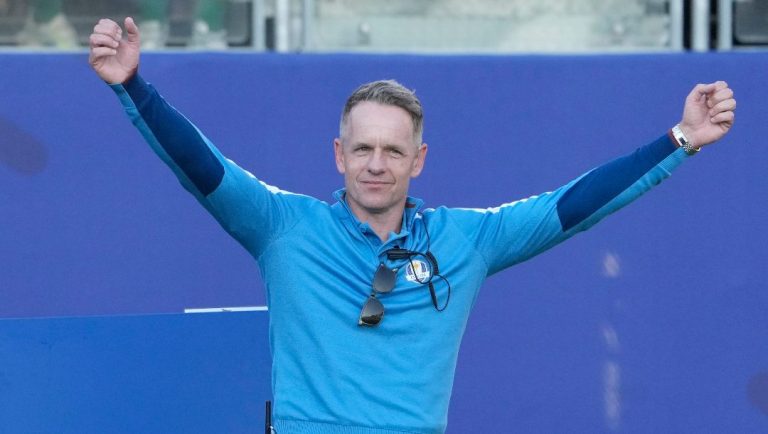Europe's Team Captain Luke Donald gestures to the crowd on the 1st tee during the morning Foursome matches at the Ryder Cup golf tournament at the Marco Simone Golf Club in Guidonia Montecelio, Italy, Friday, Sept. 29, 2023.