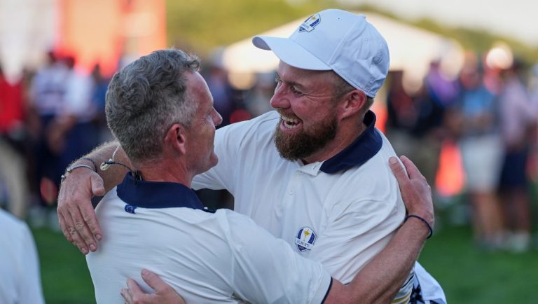 Europe's Shane Lowry celebrates with captain Luke Donald after making the winning putt at Ryder Cup golf tournament on the Bethpage Black golf course, Sunday, Sept. 28, 2025, in Farmingdale, N.Y.