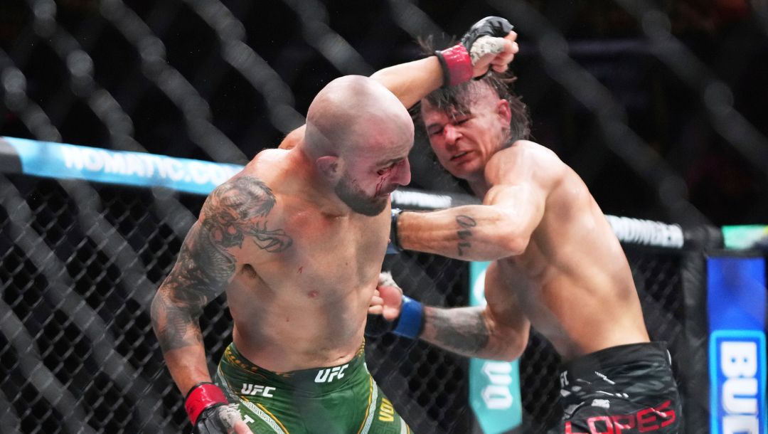 Alexander Volkanovski, left, and Diego Lopes, right, battle during a mixed martial arts fight at UFC 314.