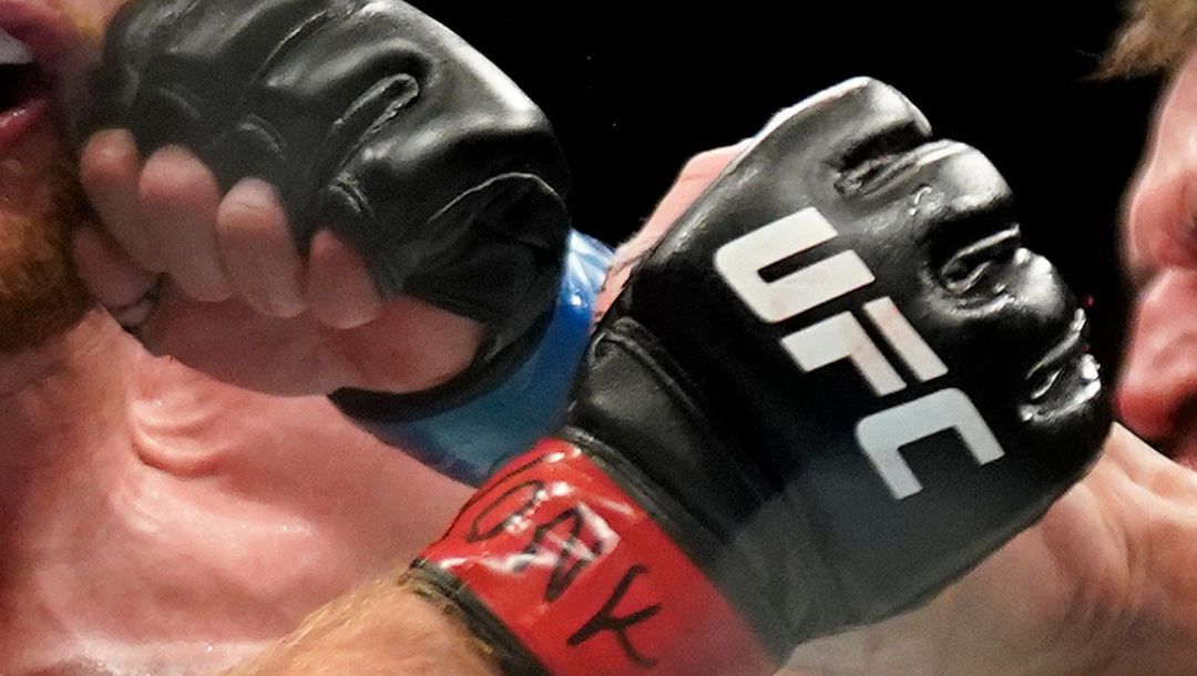 Michael Chandler, right, lands a punch against Justin Gaethje during a lightweight mixed martial arts bout at UFC 268.