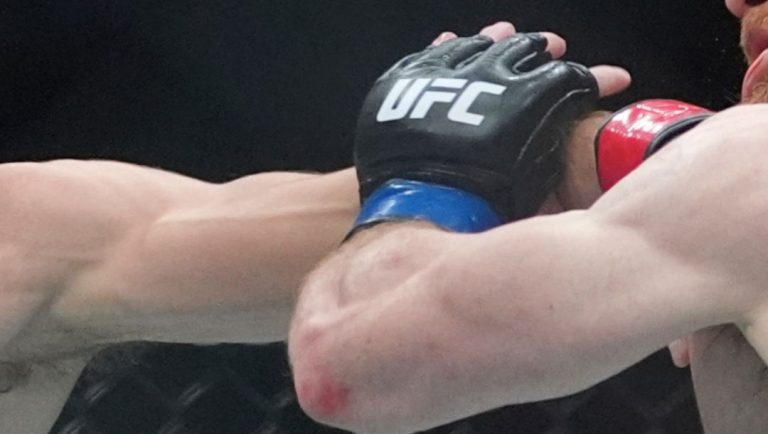 Australia's Quillan Salkilld, left, punches Israel's Yanal Ashmouz during the third round of a lightweight bout.
