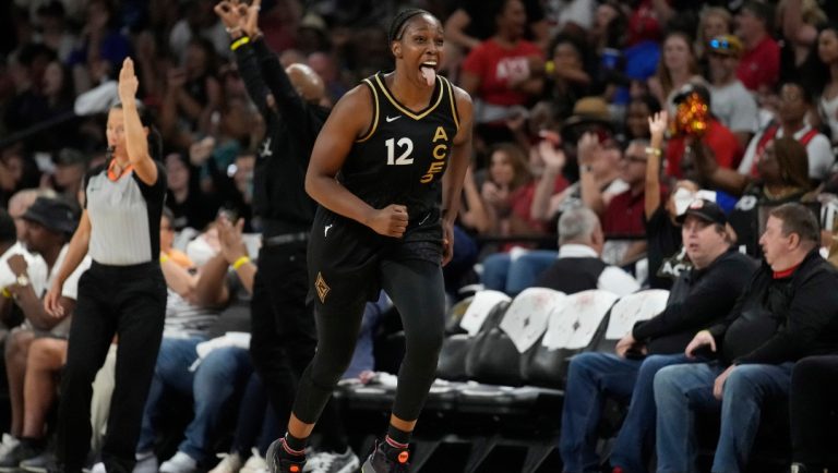 Las Vegas Aces guard Chelsea Gray (12) celebrates after making a 3-point shot against the Phoenix Mercury during the second half in Game 2 of a WNBA basketball first-round playoff series Saturday, Aug. 20, 2022, in Las Vegas.