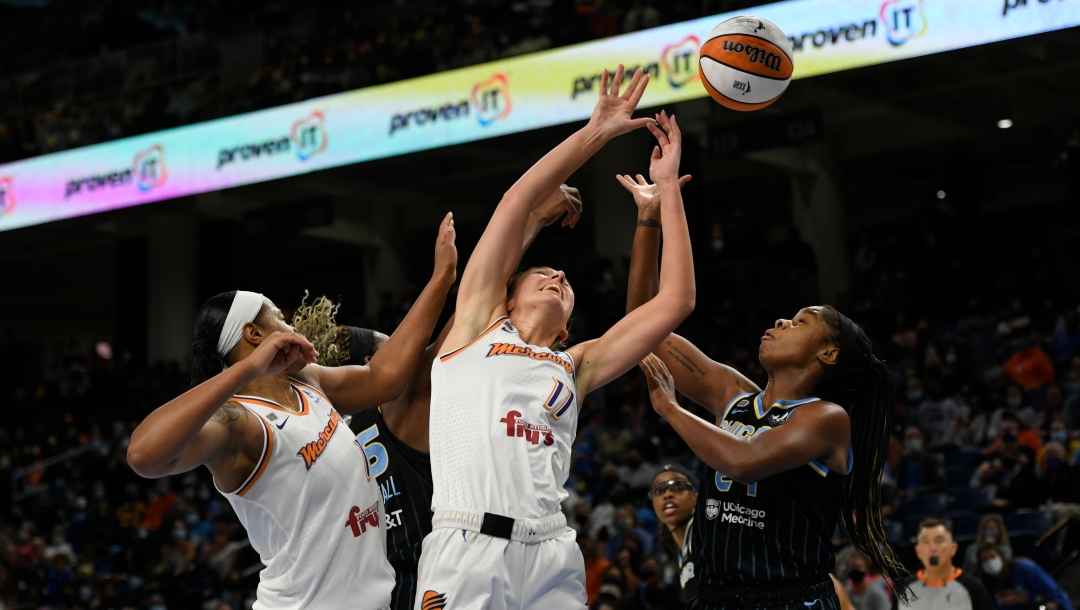 Phoenix Mercury's Alanna Smith (11) and Kia Vaughn (1) battle Chicago Sky's Ruthy Hebard (24) and Astou Ndour-Fall (45) for a rebound during the first half of Game 3 of the WNBA Finals Friday, Oct. 15, 2021, in Chicago. Chicago won 86-50.