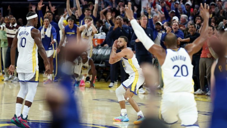 Stephen Curry #30 of the Golden State Warriors does his "night night" celebration after Jimmy Butler III #10 made a three-point basket against the Denver Nuggets in overtime at Chase Center on October 23, 2025 in San Francisco, California.