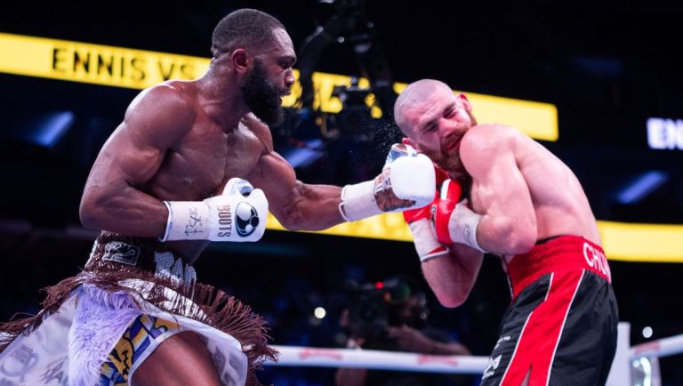Jaron Ennis, left, in action against Karen Chukhadzhian, right, during the IBF World Welterweight title bout.