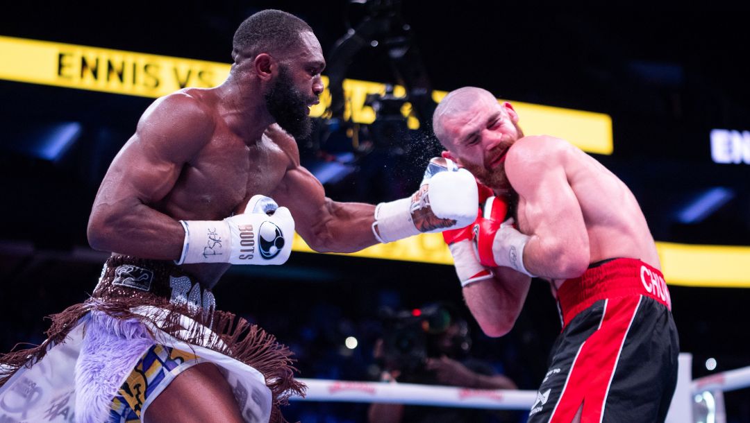 Jaron Ennis, left, in action against Karen Chukhadzhian, right, during the IBF World Welterweight title bout.