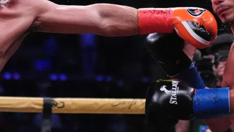 Danny Garcia, left, punches Daniel Gonzalez during the third round of a junior middleweight boxing match Sunday, Oct. 19, 2025.