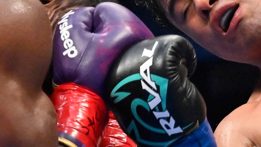 Lester Martinez, right, throws a punch at Christian Mbilli during a WBC super middleweight interim world championship.