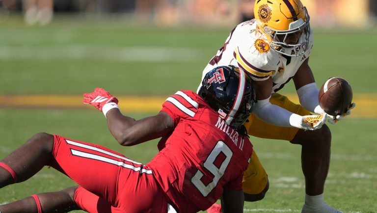 Arizona State linebacker Martell Hughes intercepts the ball intended for Texas Tech tight end Johncarlos Miller II (9) in the second half of an NCAA college football game Saturday, Oct. 18, 2025, in Tempe, Ariz.