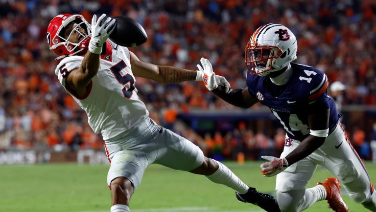 Georgia wide receiver Noah Thomas (5) tries to catch a pass as Auburn defensive back Rayshawn Pleasant (14) defends during the second half of an NCAA college football game, Saturday, Oct. 11, 2025, in Auburn, Ala.