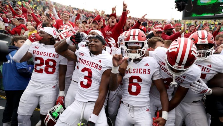 Indiana running back Khobie Martin (28), defensive lineman Daniel Ndukwe (17), defensive back Jaylen Bell (3), wide receiver Lebron Bond (6), wide receiver Davion Chandler (4), defensive lineman Tyrique Tucker (95), and Indiana supporters celebrate their 30-20 win over Oregon in an NCAA college football game, Saturday, Oct. 11, 2025, in Eugene, Ore.