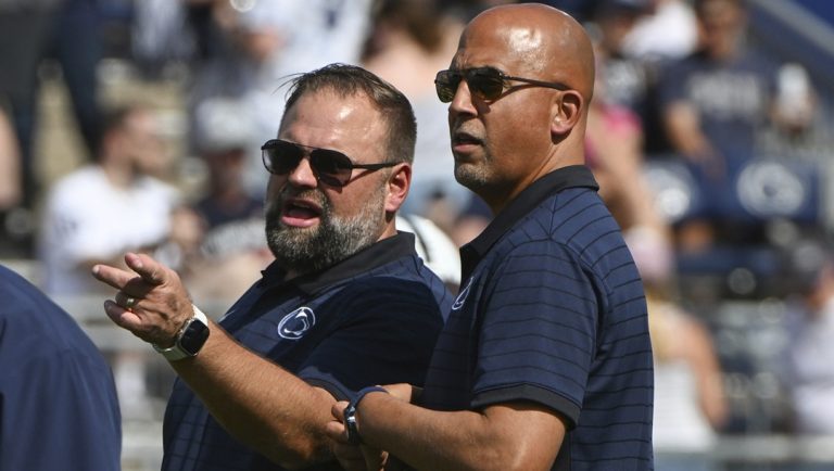 Penn State offensive coordinator Andy Kotelnicki talks with head coach James Franklin during warm ups for an NCAA college football game against Villanova, Saturday, Sept. 13, 2025, in State College, Pa.