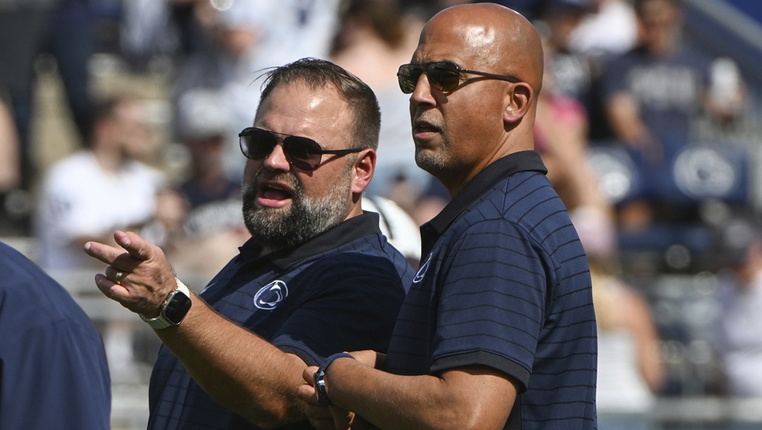 Penn State offensive coordinator Andy Kotelnicki talks with head coach James Franklin during warm ups for an NCAA college football game against Villanova, Saturday, Sept. 13, 2025, in State College, Pa.