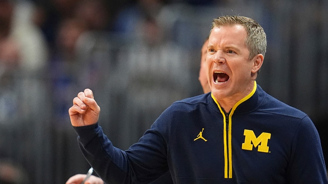Michigan head coach Dusty May directs his team against Texas A&M during the first half in the second round of the NCAA college basketball tournament Saturday, March 22, 2025, in Denver. (AP Photo/David Zalubowski)