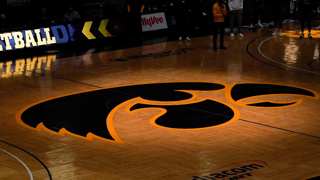 The University of Iowa Tigerhawk logo is seen on the court in Carver Hawkeye Arena before an NCAA college basketball game between Iowa and Wisconsin, Sunday, March 7, 2021, in Iowa City, Iowa. (AP Photo/Charlie Neibergall)