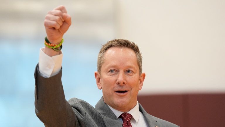 Minnesota's head coach Niko Medved gestures while arriving for an NCAA college basketball news conference, Tuesday, March 25, 2025, in Minneapolis. (AP Photo/Abbie Parr)