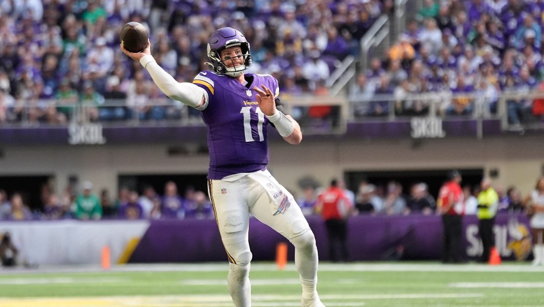 Minnesota Vikings quarterback Carson Wentz (11) passes during the second half of an NFL football game against the Philadelphia Eagles, Sunday, Oct. 19, 2025, in Minneapolis.