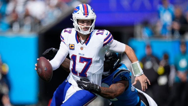 Carolina Panthers linebacker Trevin Wallace (32) sacks Buffalo Bills quarterback Josh Allen (17) during the first half an NFL football game, Sunday, Oct. 26, 2025, in Charlotte, N.C.