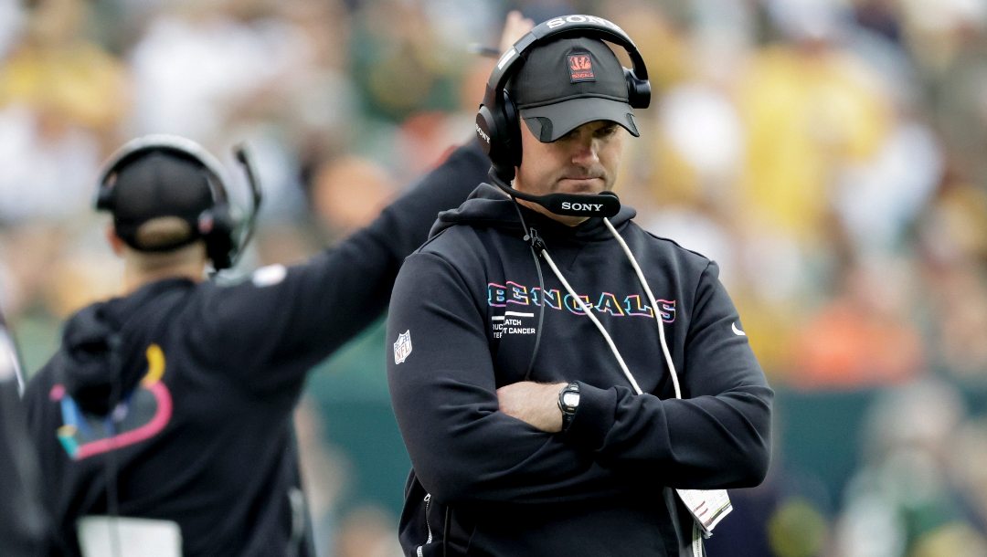 Cincinnati Bengals head coach Zac Taylor walks the sidelines in the first half of an NFL football game against the Green Bay Packers, Sunday, Oct. 12, 2025, in Green Bay, Wis.