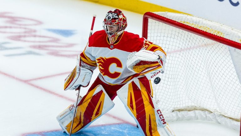 Calgary Flames goaltender Dustin Wolf warms up before an NHL hockey game against the Seattle Kraken, Monday, Sept. 29, 2025, in Seattle.