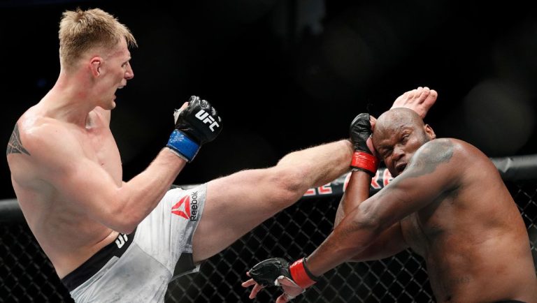 Alexander Volkov, left, kicks Derrick Lewis during a heavyweight mixed martial arts bout at UFC 229 in Las Vegas.