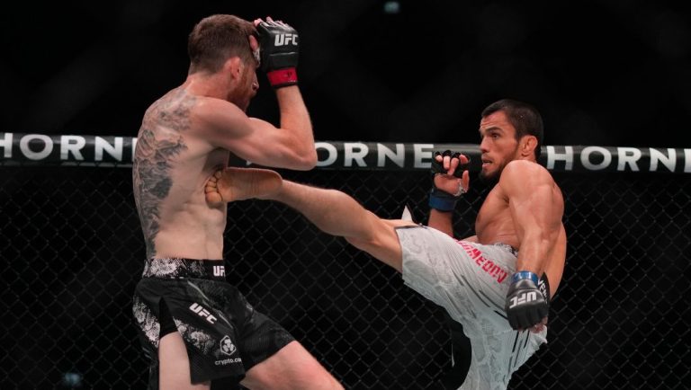 Russia's Umar Nurmagomedov, right, fights with Cory Sandhagen, of the United States, in a bantamweight bout at UFC Fight Night.